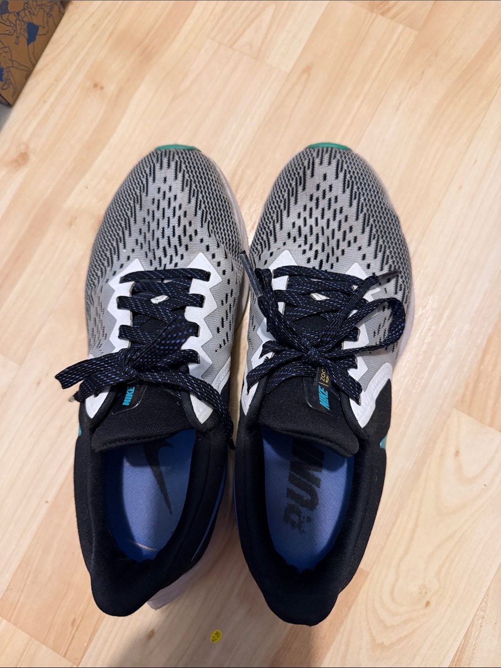 Nike Women's Gray and Black Running Shoes with Teal Accents